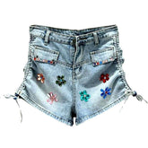 Shorts vaqueros con cordones adornados con flores